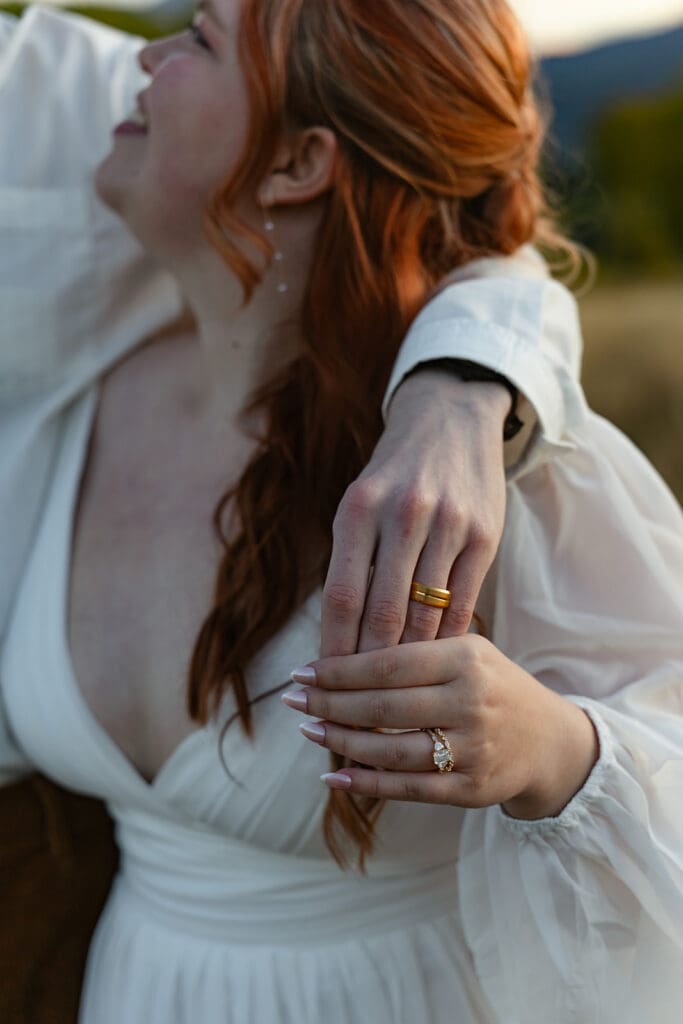 Close-up of bride’s engagement ring and wedding band during a Crested Butte elopement, featuring romantic mountain elopement details, bridal jewelry inspiration.