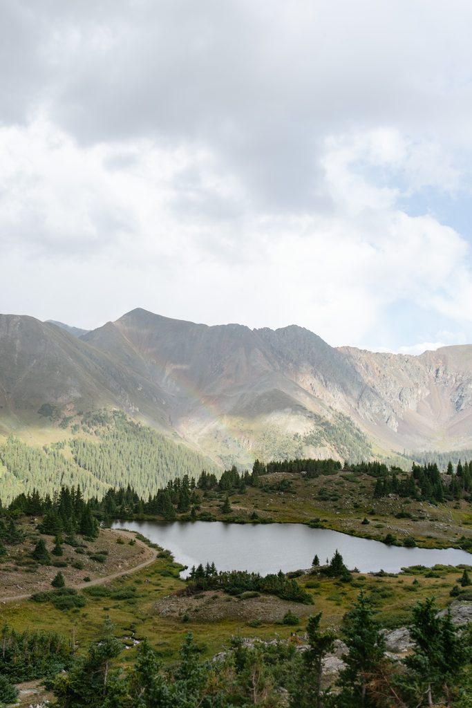a rainbow faintly appearing at Pass Lake
