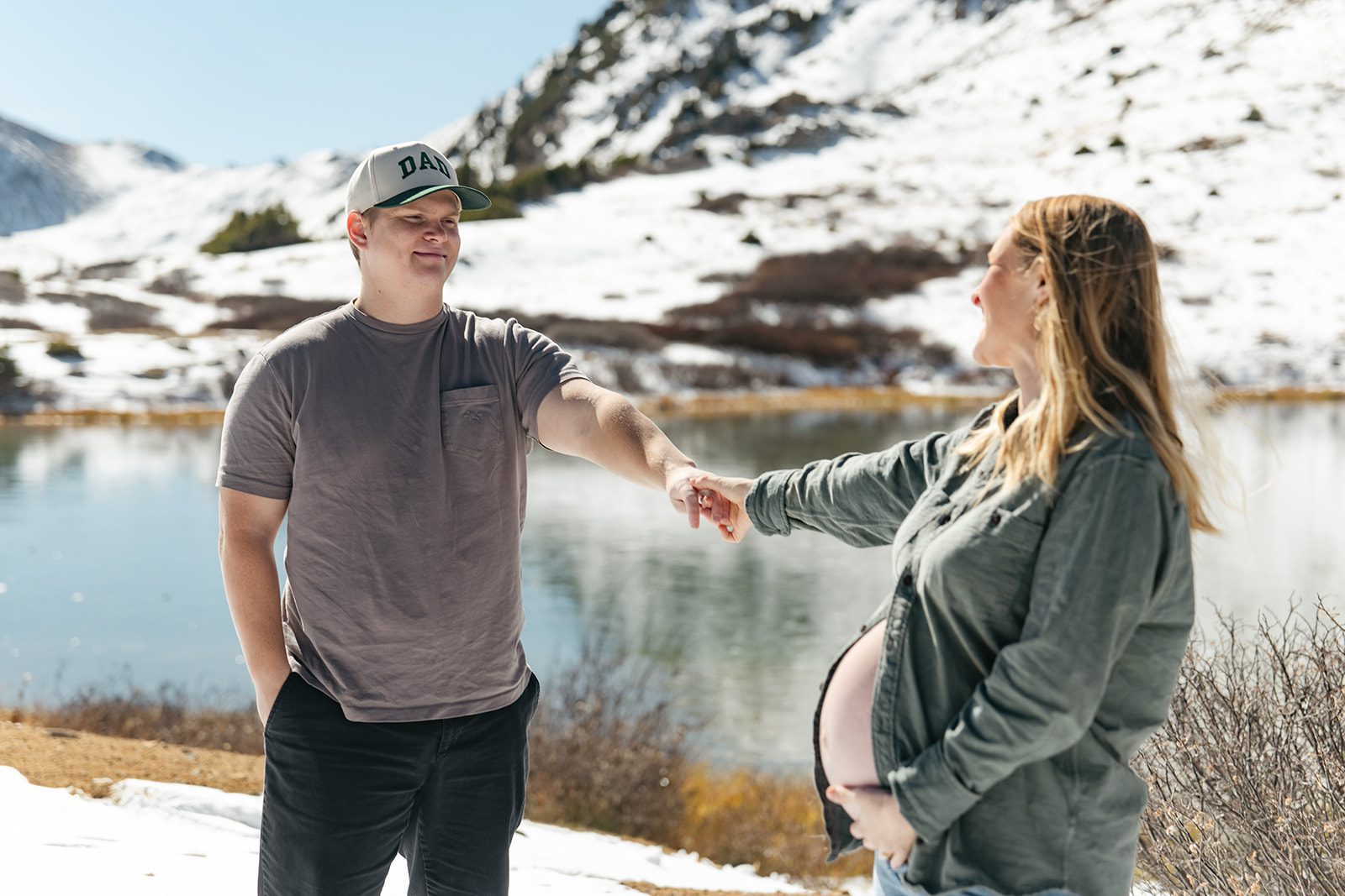 a new mom and dad take maternity photos at Pass Lake
